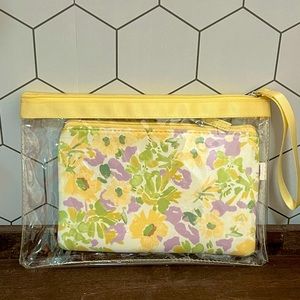 NWT- Clear Clutch with neoprene yellow/purple floral pouch inside.